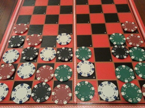 physical prototype of Sweep Stacks, using a checkerboard and various colors of poker chips